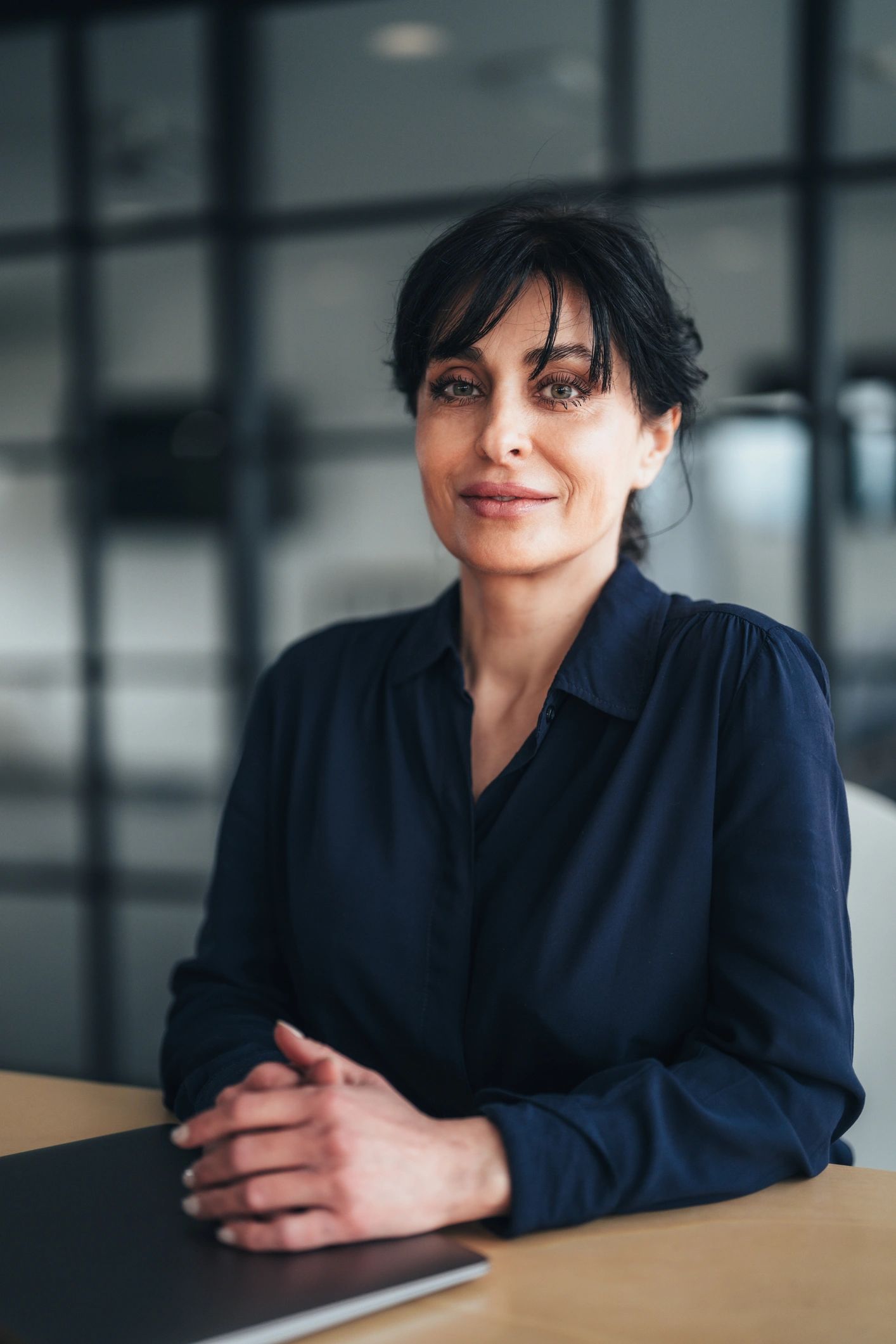 Confident legal consultant seated in a modern office